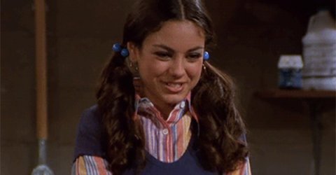 Cute American actress Jackie Burkhart leads a cherleader role as a Mila" Kunis in That 70s Show