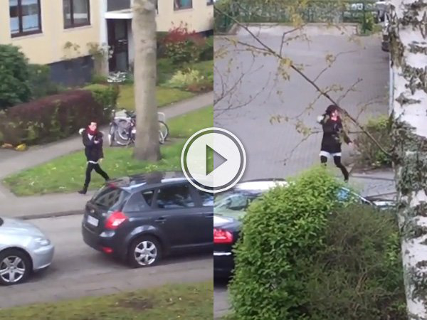 Crazy-ass squirrel chases down street (Video)