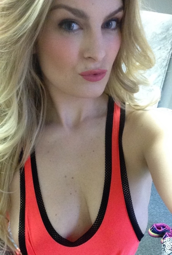 HOt blonde making a pout while showing her cleavage