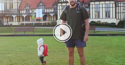 Screenshot image of a video of daddy standing with a little kid