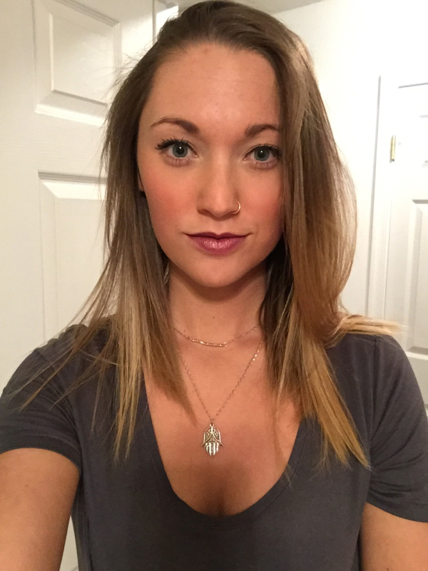 Girl poses for a selfie with sleek neckpiece