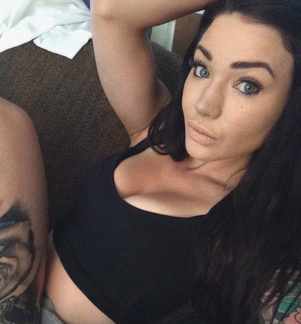 Hot girl with blue eyes and black hair clicking selfie