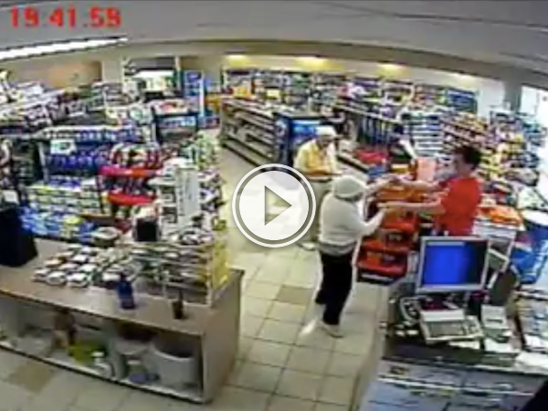 Guy slow dances with an elderly lady in a gas station (Video)