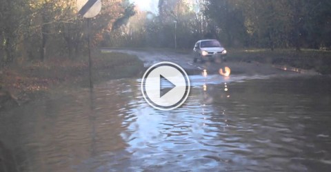 Funny video of a car getting stuck in a deep road filled with water.