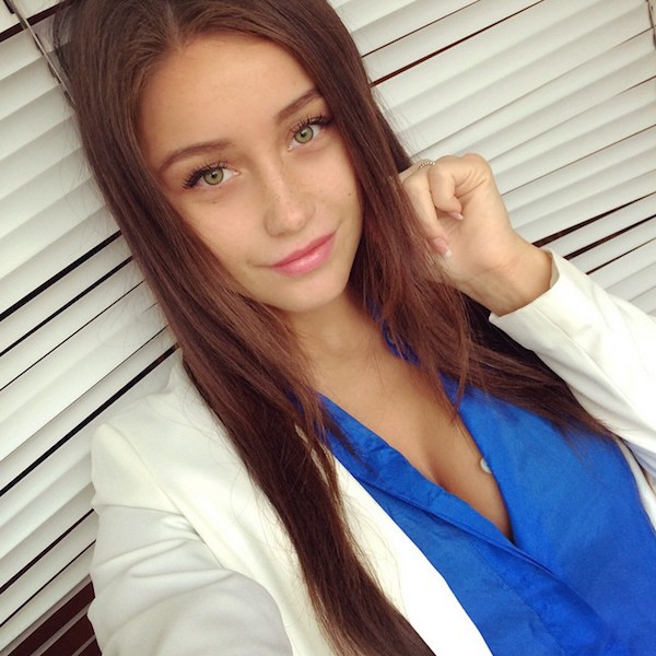 Beautiful girl with blue eyes and white coat clicked nicely