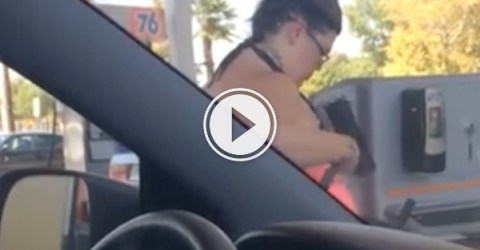 Woman bathes herself with gas station squeegee