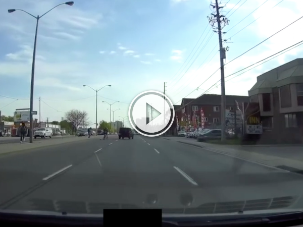 Jeep narrowly misses four idiots dashing across the road! (Video)