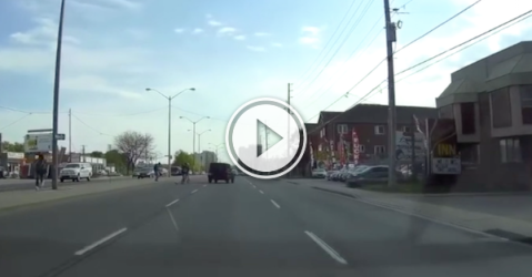 Jeep narrowly misses four idiots dashing across the road! (Video)