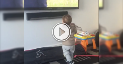 This kid's so into golf, he'll practice with anything! (Video)