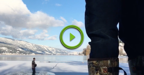 Dude jumps into the cold lake to rescue a trapped dog (Video)