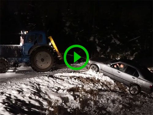 Tractor pulling car out of ditch only makes it worse (Video)