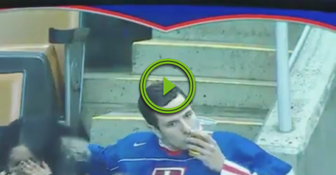 Hockey fan's got his priorities straight, that's for sure (Video)