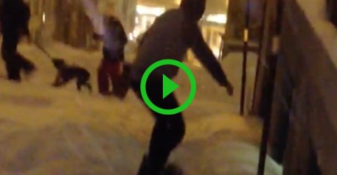 Guy snowboarding down street gets hit by car (Video)