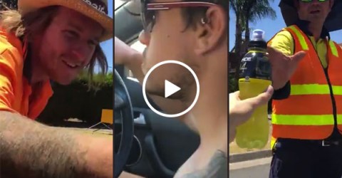 Aussie dudes hand out cold drinks to road workers in tripe digit heat