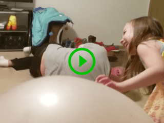 Dad sinks through large inflated balls in painful fail (Video)