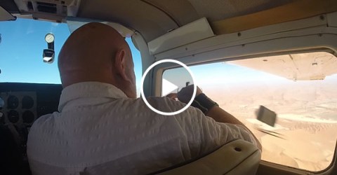 Guy gets his camera sucked out of airplane window (Video)
