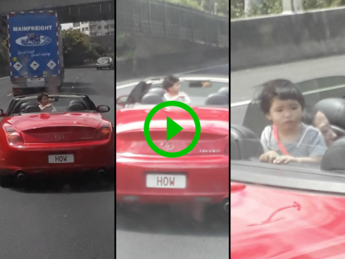 Kid walks around back of moving convertible (Video)