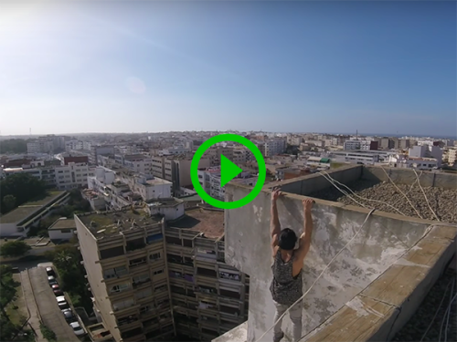 Man does workout on top of high-rise building (Video)
