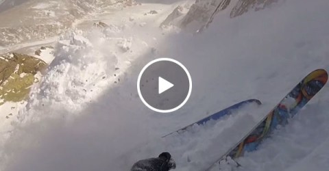 Skier caught in massive avalanche (Video)