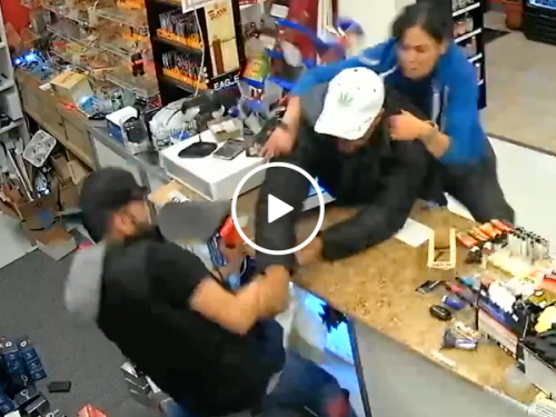 Family fights off flair gun wielding robber (Video)