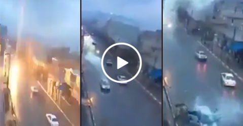 Lightning strikes a car as it drives down the road (Video)
