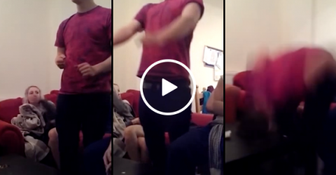 Guy smashes his head through a table and gets stuck (Video)