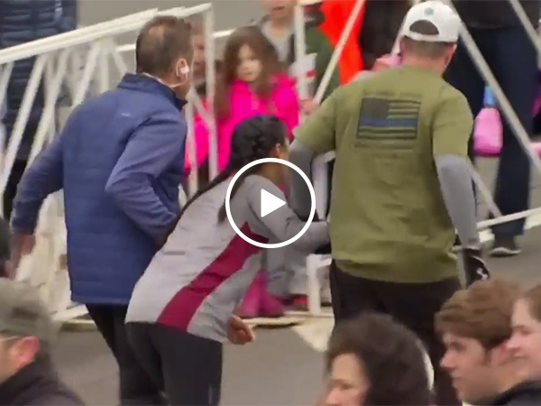 Two guys jump in to help distressed girl at half marathon