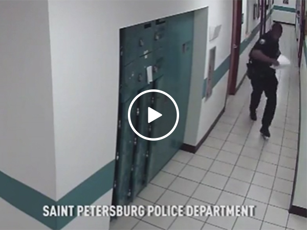 Cop caught on CCTV running away from a little mouse (Video)