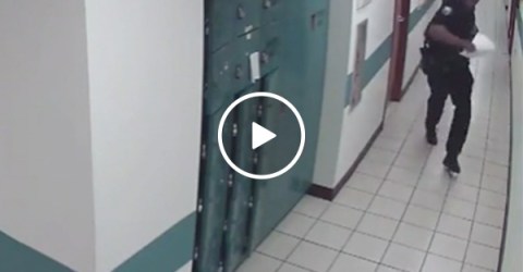 Cop caught on CCTV running away from a little mouse (Video)