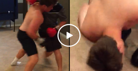 Basement boxing match ends in a wall knock out (Video)