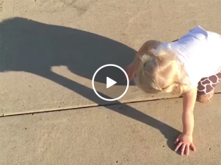 Little girl really wants to get rid of her shadow (Video)