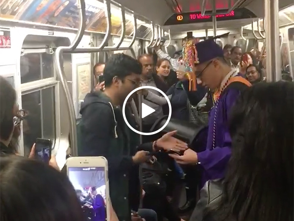 Kid has makeshift graduation on subway