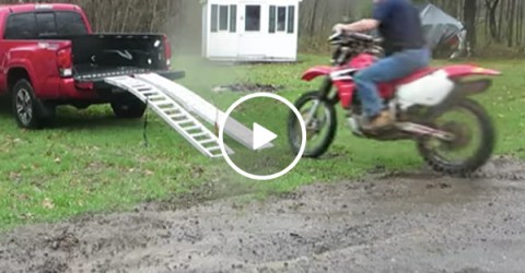 Guy fails at loading motorcycle into his truck