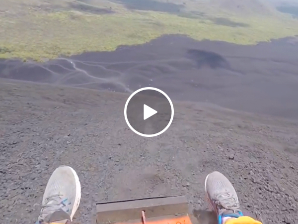 Sledding down a volcanic ash hill at 40 MPH seems... safe? (Video)