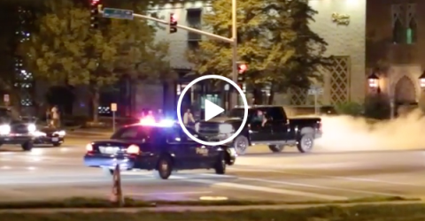 Truck does sick burn out in front of cop (Video)