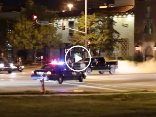 Truck does sick burn out in front of cop (Video)
