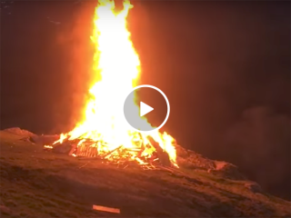 Bonfire explodes without warning (Video)