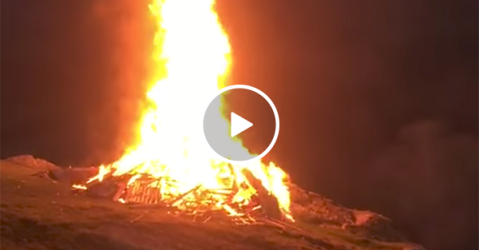 Bonfire explodes without warning (Video)