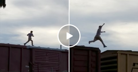 Guy runs on top of train