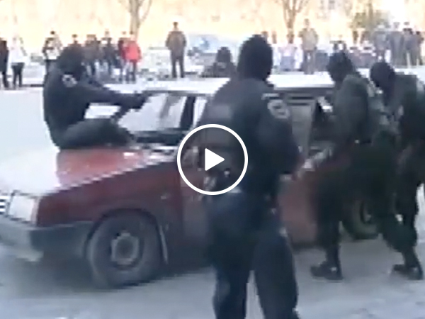 Russian police jumps into windshield to stop car (Video)