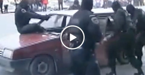 Russian police jumps into windshield to stop car (Video)