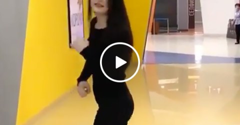 Sexy and Fit Girl Punches an Arcade Game and Almost Knocks It Over