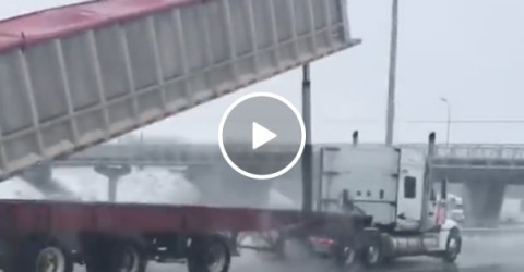 Raised truck bed hits bridge in an explosion of seeds (Video)