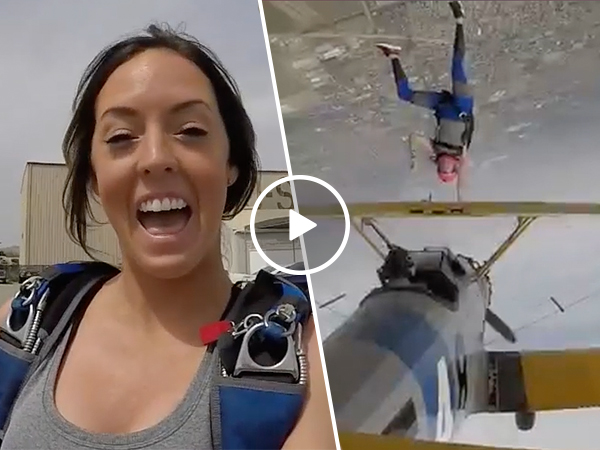Woman performs bad ass upside-down biplane skydive (Video)