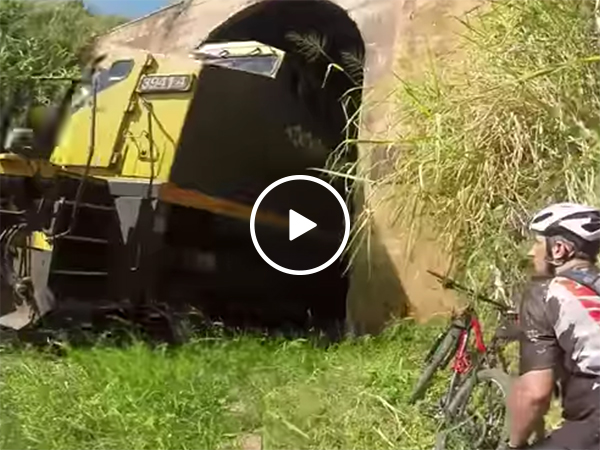 Cyclist narrowly misses train coming the other way through tunnel
