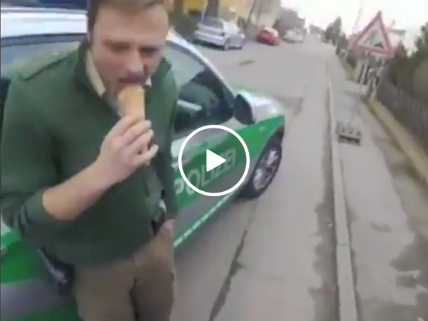 German cop pulls over motorcycle while eating ice cream (Video)