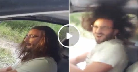 Car's bass system blows man's hair everywhere