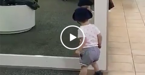 Kid At a Shopping Mall Is Confused By a Mirror