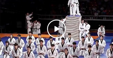 Korean Karate Team Kicks Boards and Does Backflips