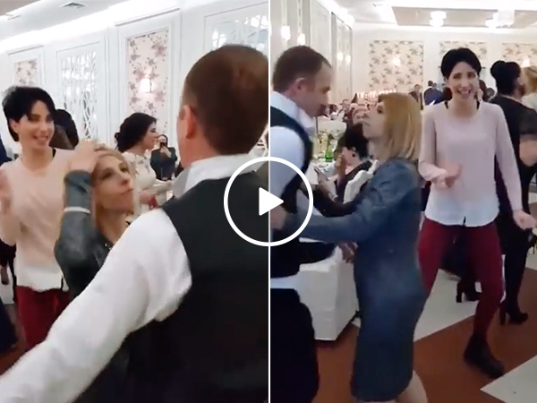 Jealous wife really, really doesn't like sharing the dance floor (Video)
